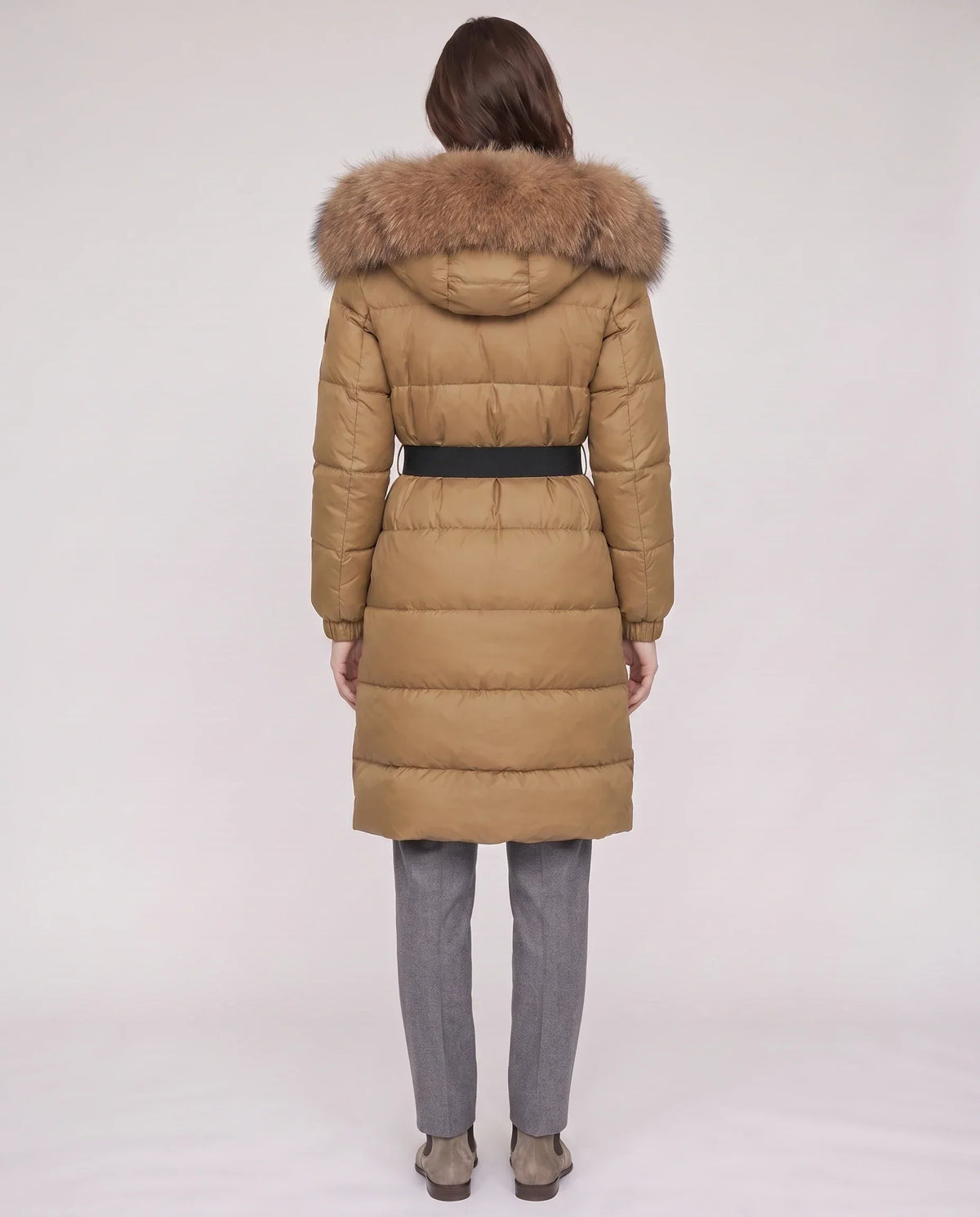 Long belted puffer jacket with a faux fur hood