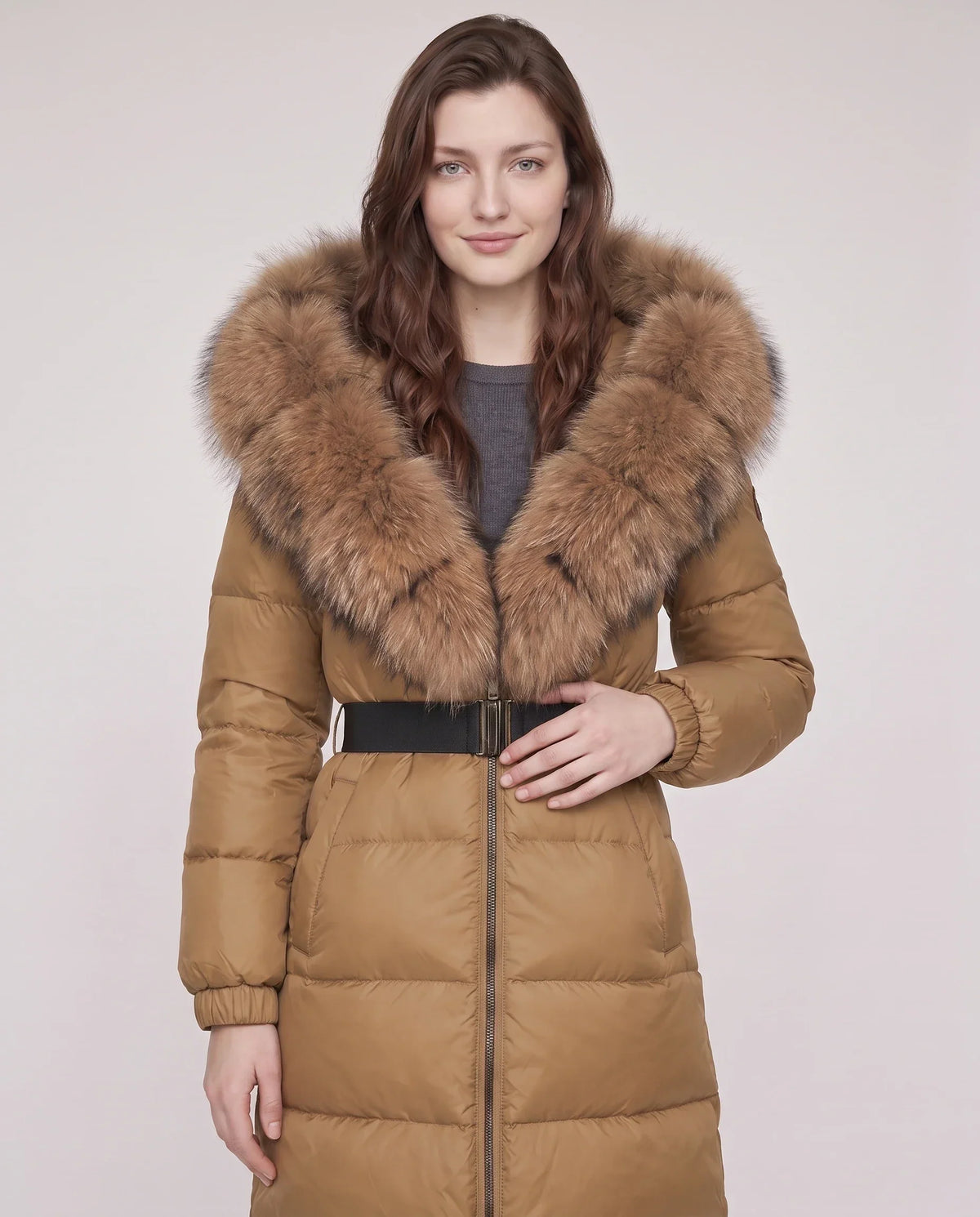 Long belted puffer jacket with a faux fur hood