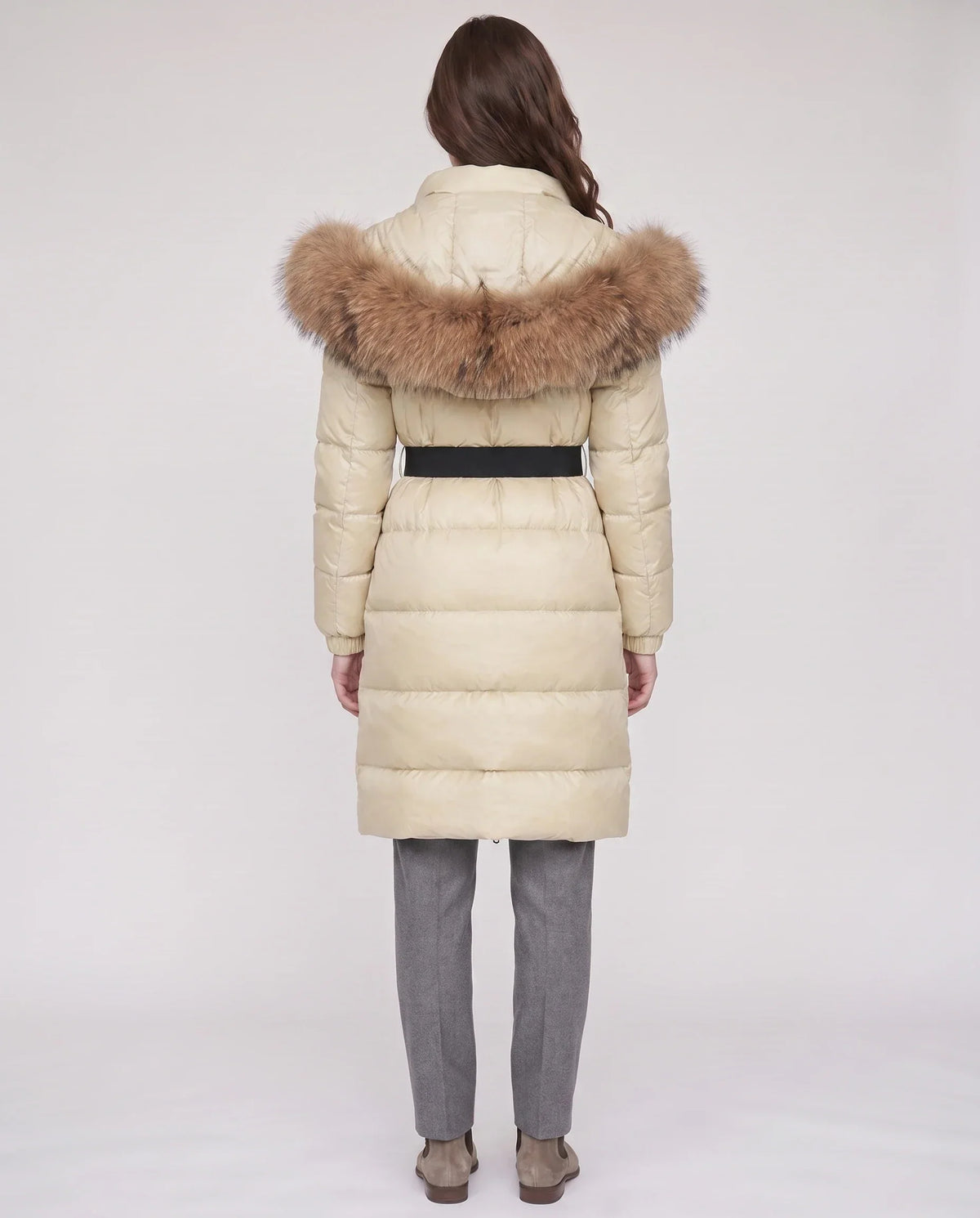Long belted puffer jacket with a faux fur hood