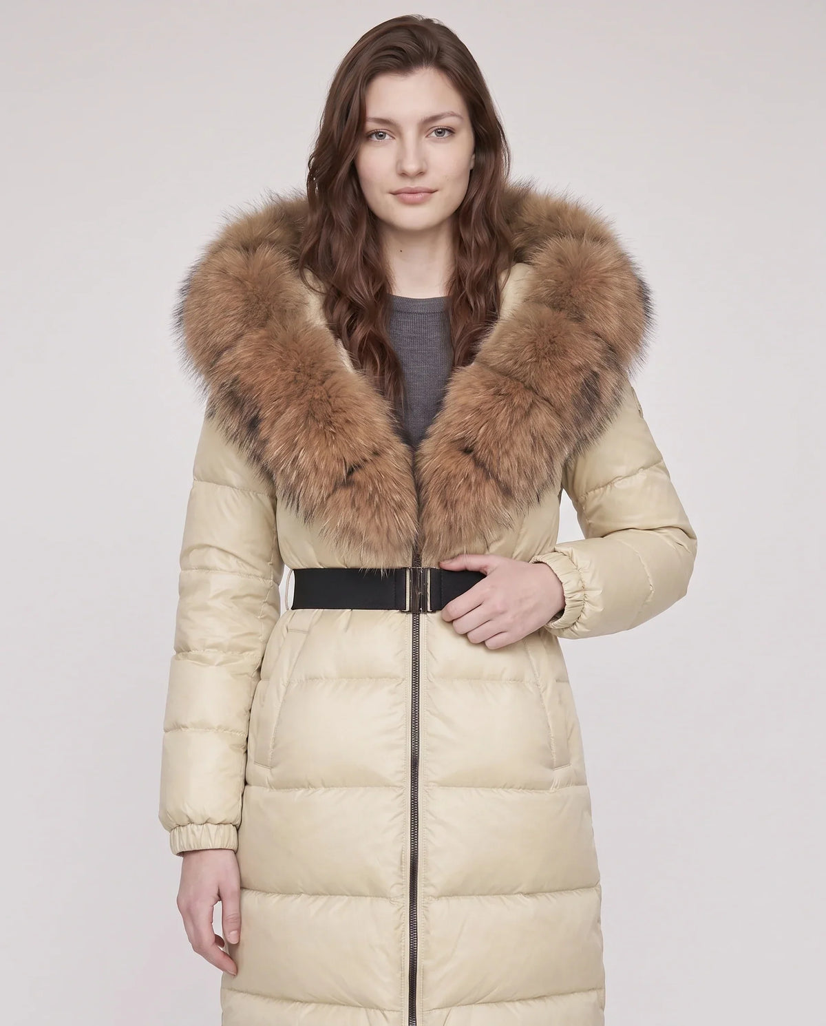 Long belted puffer jacket with a faux fur hood
