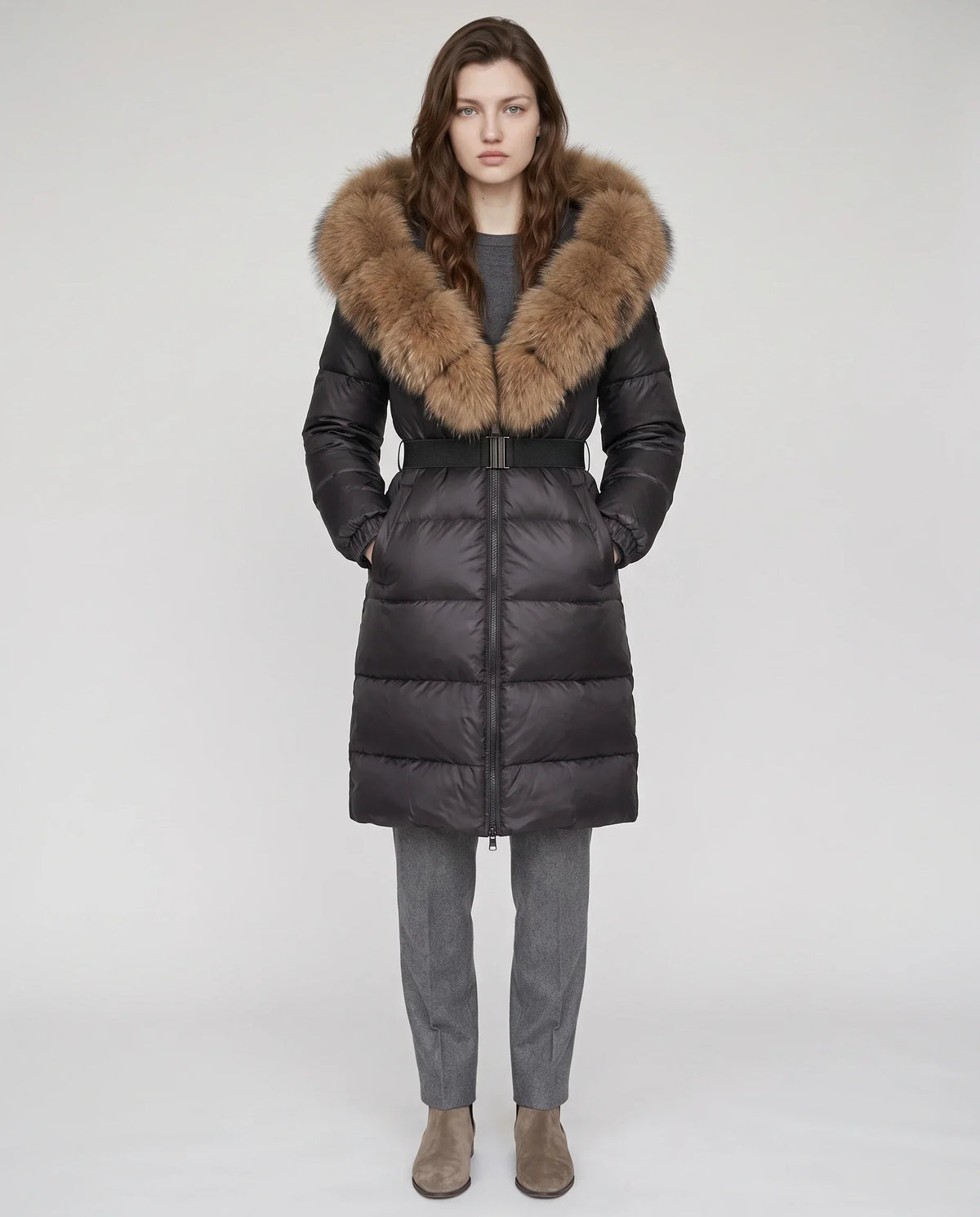Long belted puffer jacket with a faux fur hood