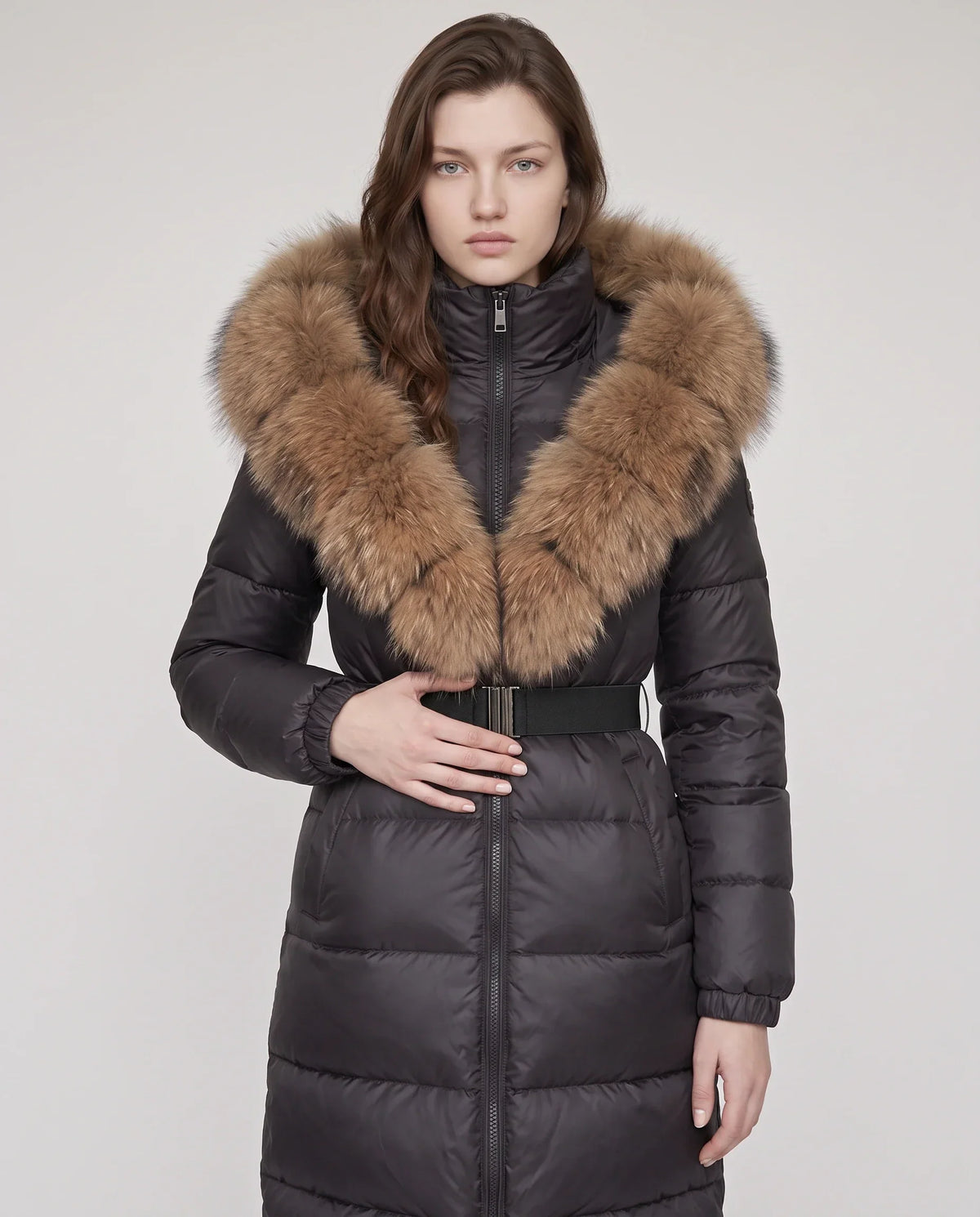 Long belted puffer jacket with a faux fur hood