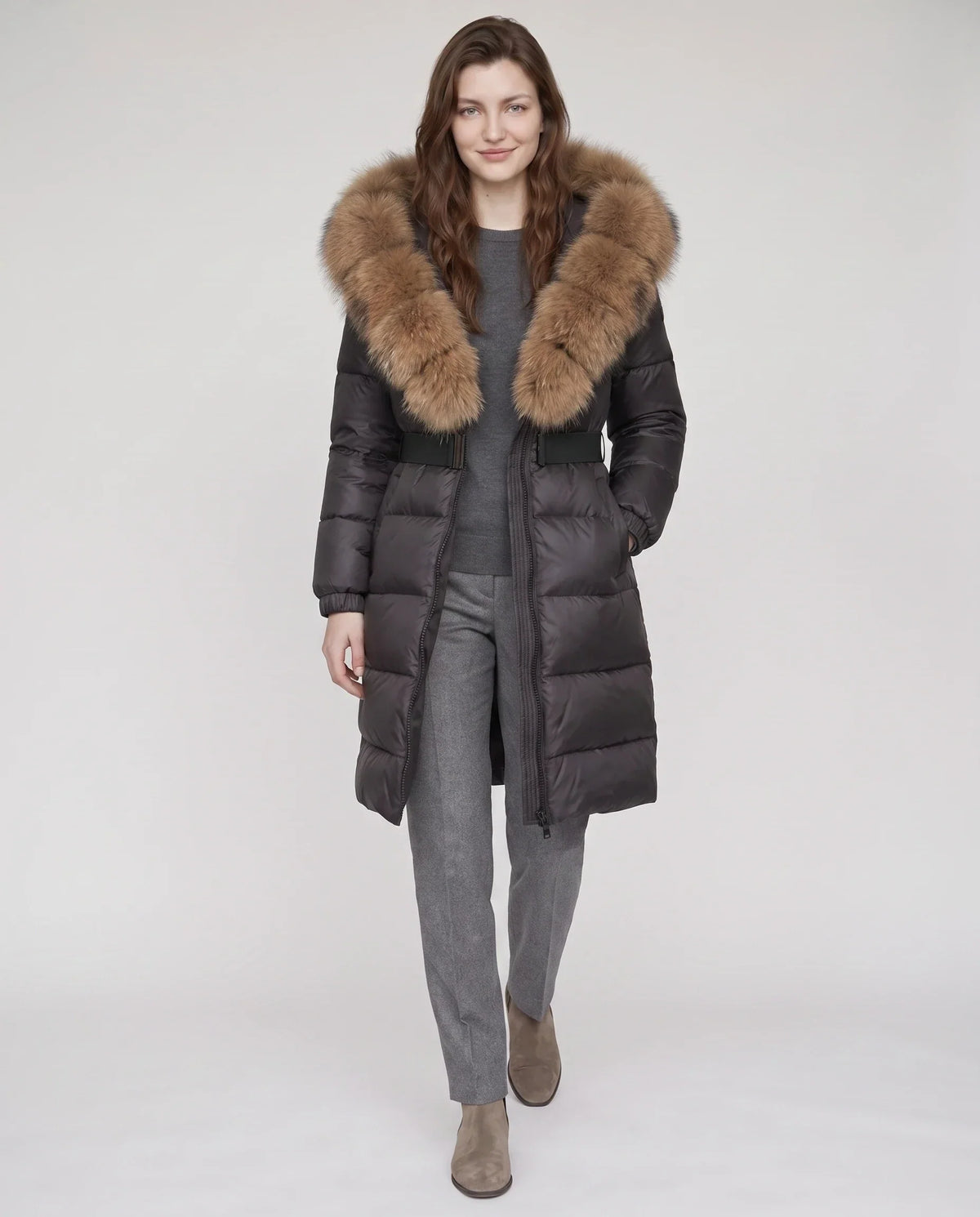 Long belted puffer jacket with a faux fur hood