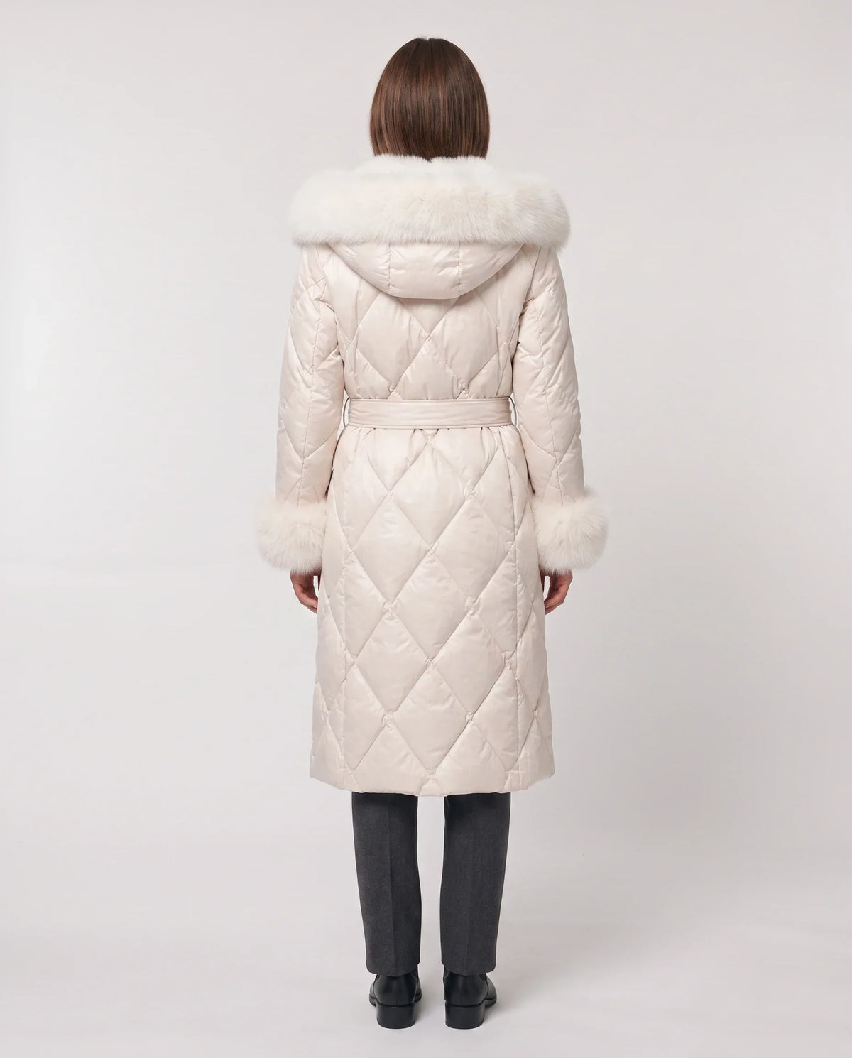 Long wrap-style puffer jacket with a fur-trimmed hood
