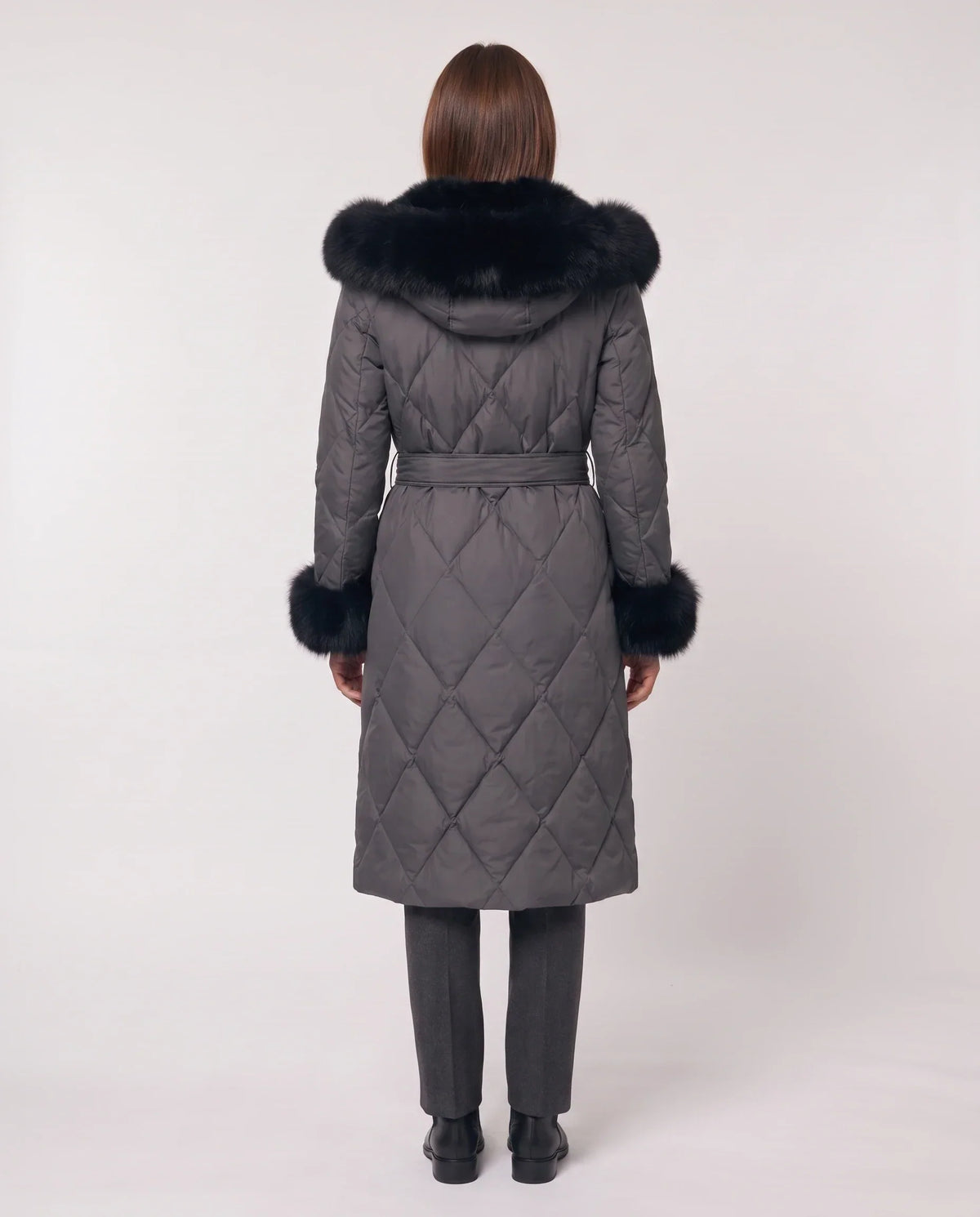 Long wrap-style puffer jacket with a fur-trimmed hood